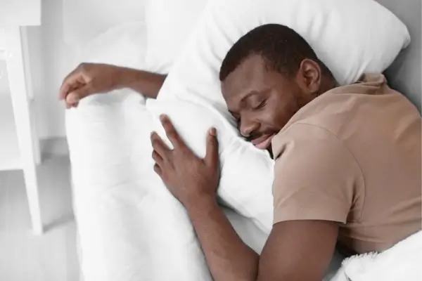 Person following a calming evening wind down routine before bed